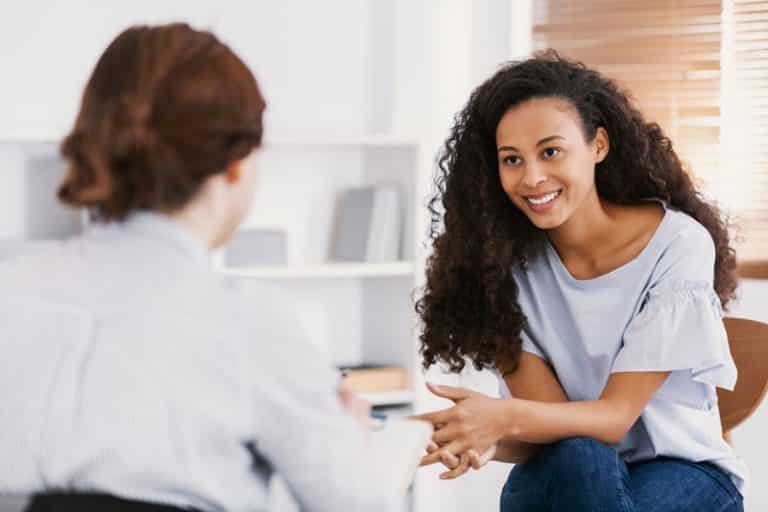 speech pathologist with young patient