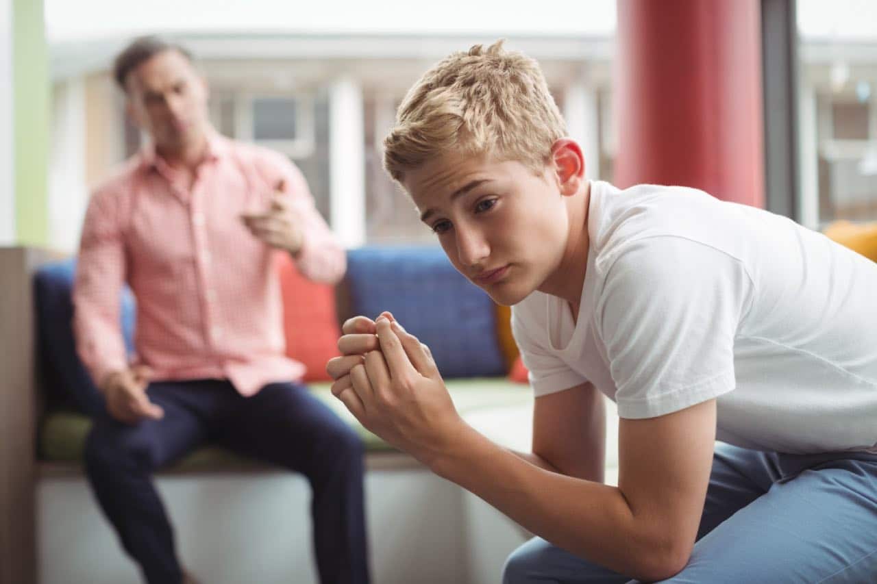 Teen boy is struggling to maintain relationship with his father. 