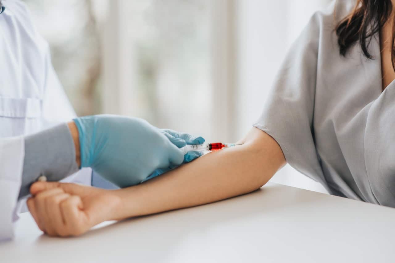 A woman taking blood test for hormone health check to start a family