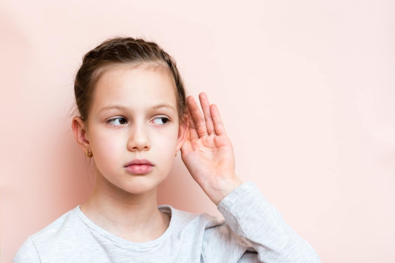 Young girl suffering hearing loss finding difficult to speak
